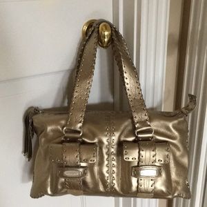 Michael Kors gold metallic hand bag with zip top